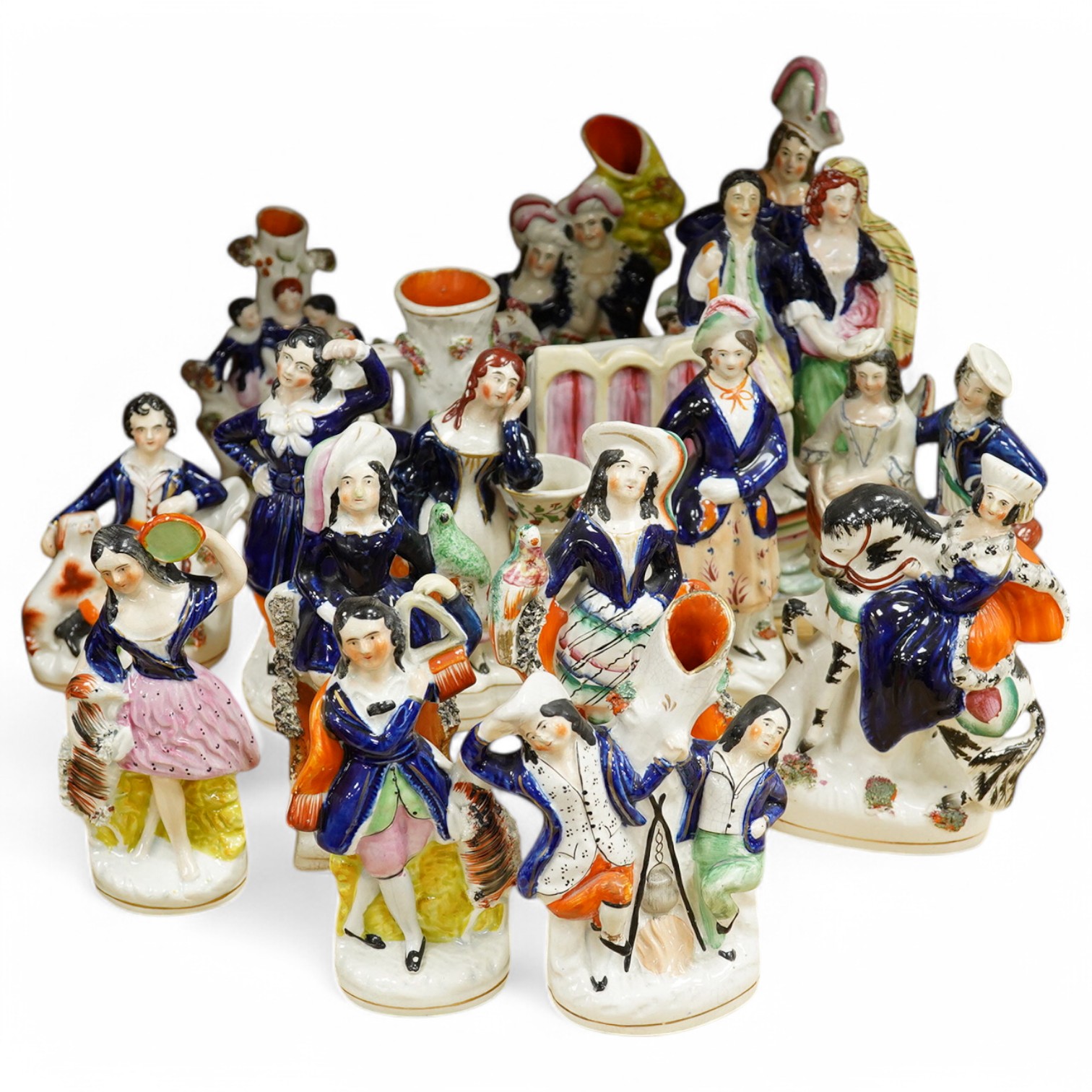 Sixteen various Staffordshire figures, tallest 27cm. Condition - varies